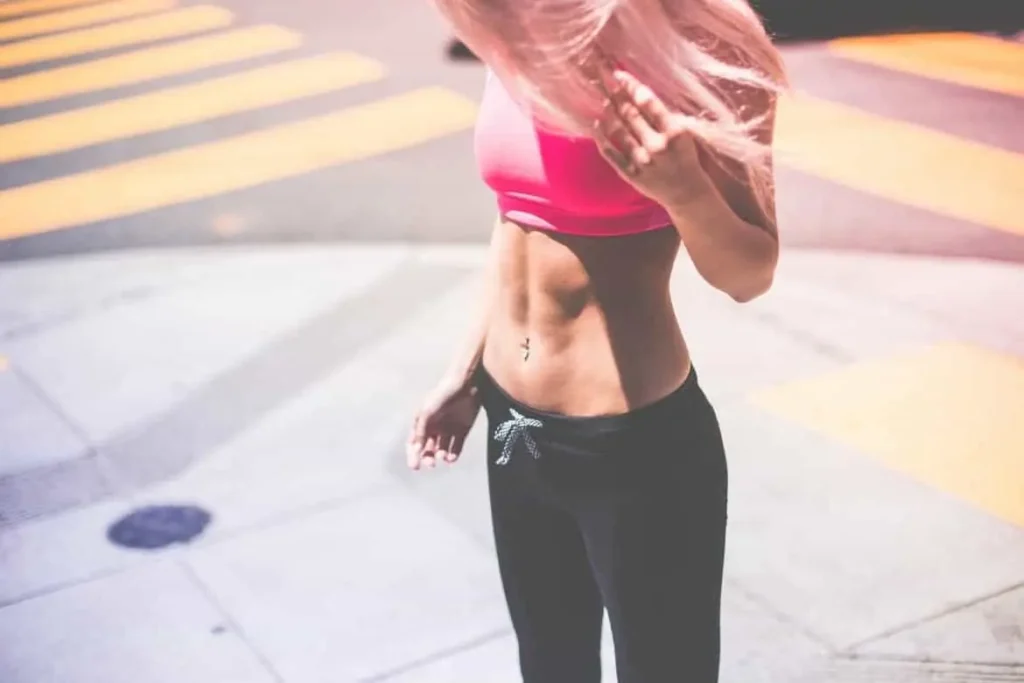 Woman with toned stomach after LA-EMS Body Sculpting Treatment Chalk Farm